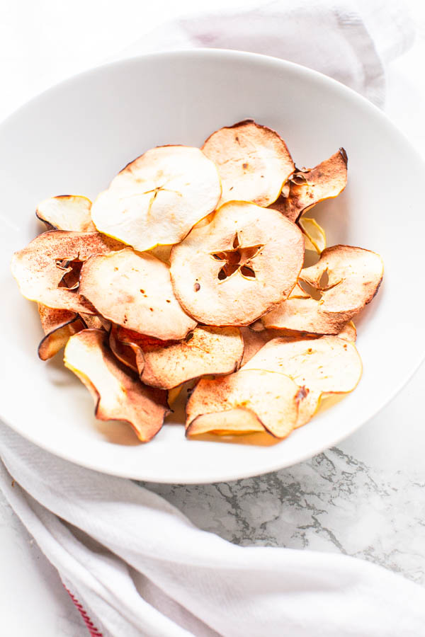 Air Fryer apple chips in white bowl