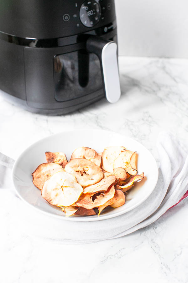 Air Fryer apple chips in white bowl