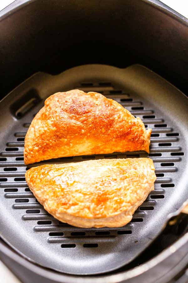 Tasty berry hand pies on a grill plate in an Air Fryer.