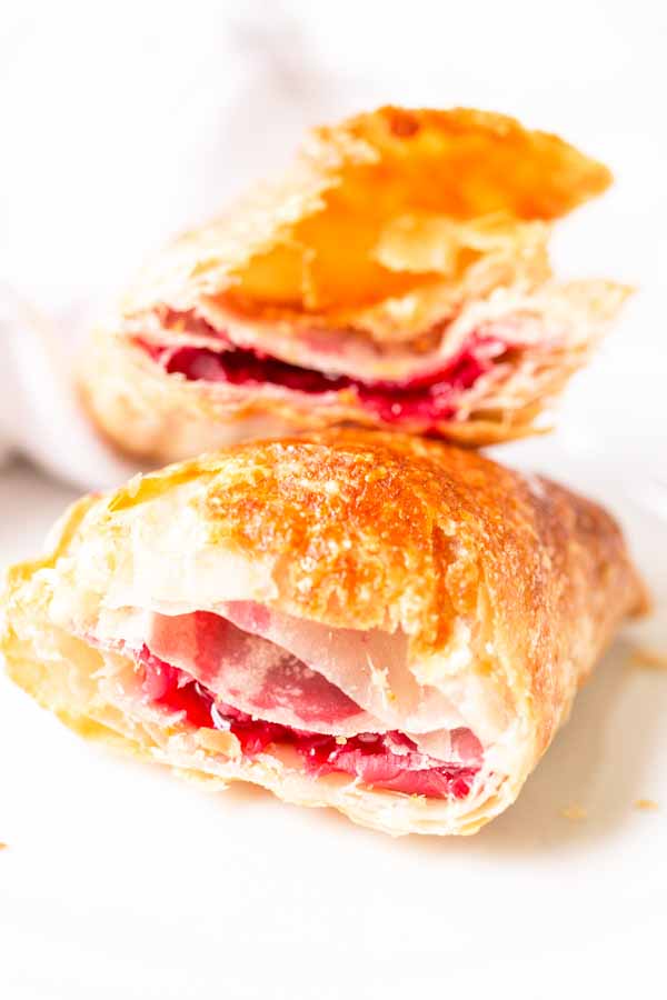 Homemade Air Fryer berry hand pie that is cut in half.
