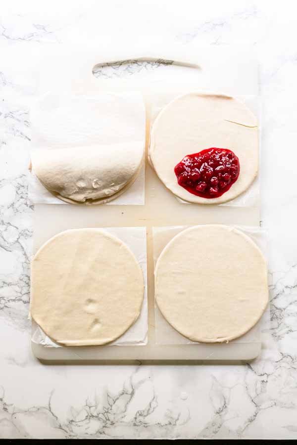 Filling hand pies with berries before putting them in an Air Fryer.