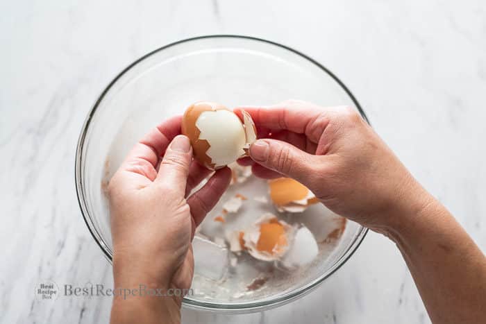 Peeling a hard boiled egg