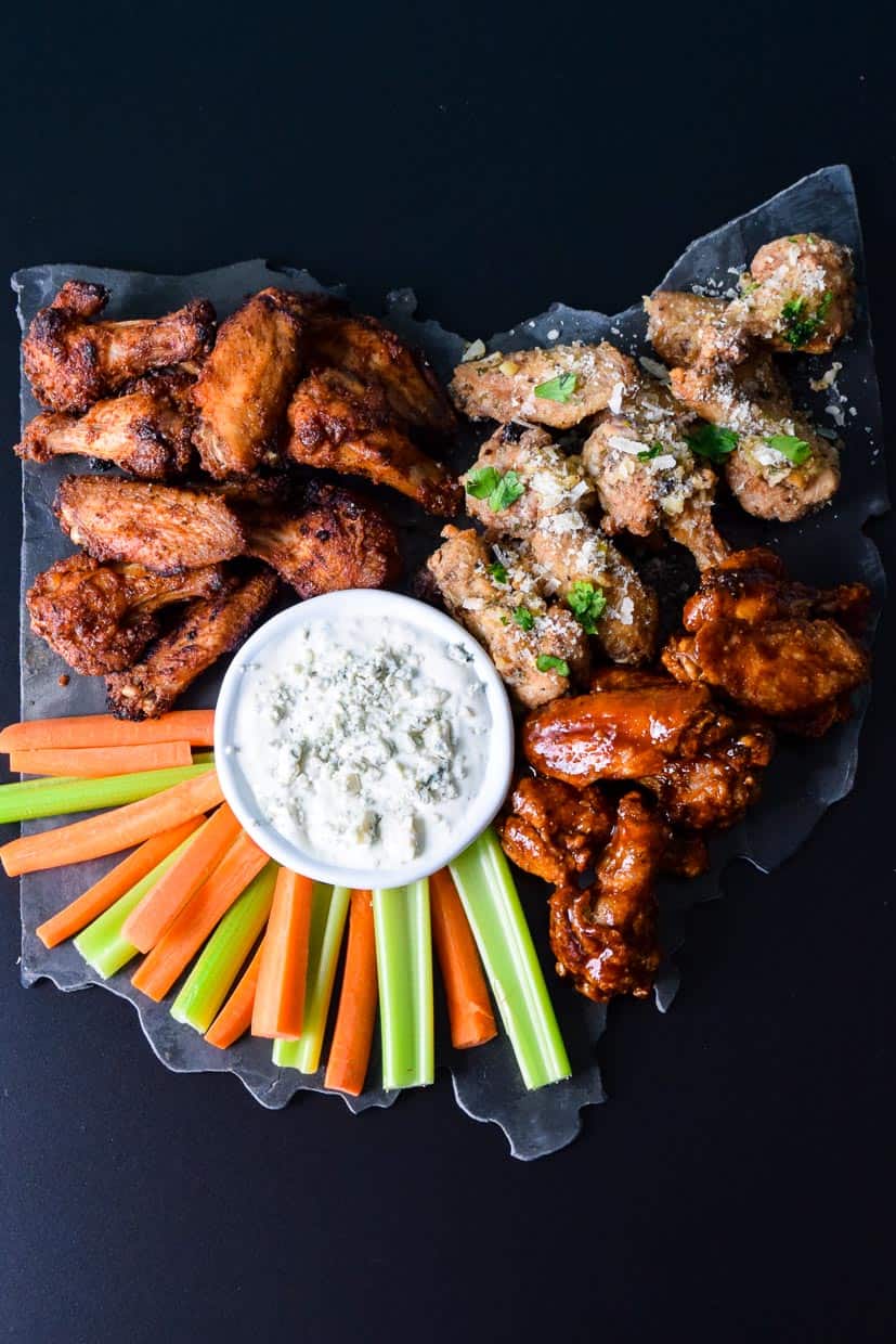 Air Fryer Game Day Wings served on black Ohio shaped platter with blue cheese and veggies overhead shot