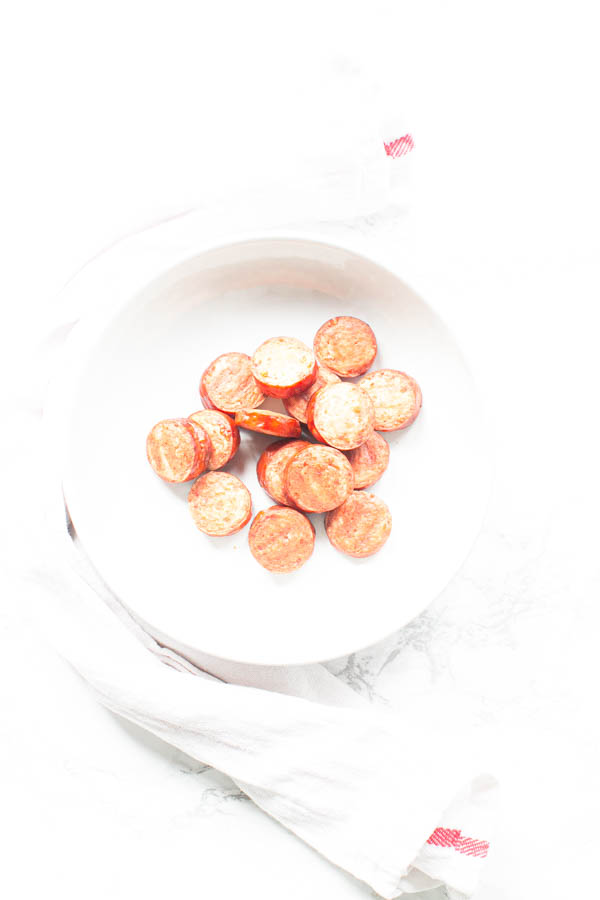 Smoked sausage in white bowl