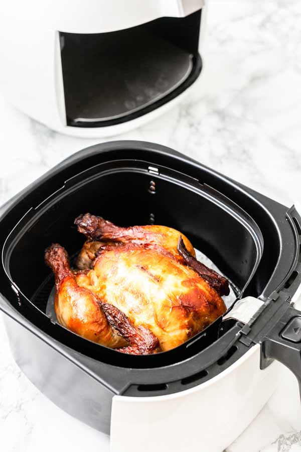 Yes, you can grill a whole chicken in an Air Fryer. This Air Fryer whole chicken recipe is great. Juicy chicken meat with crispy skin. A super easy recipe that you can serve for dinner.