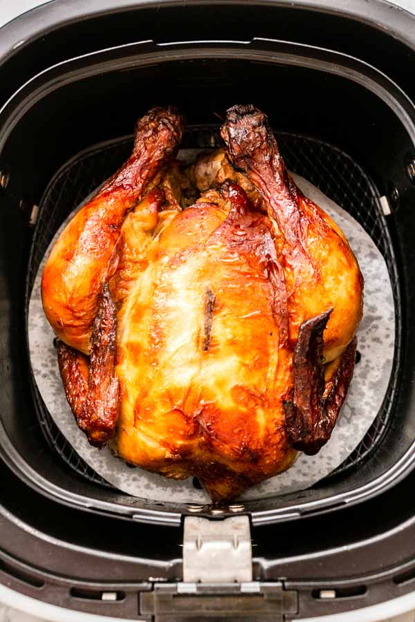 Yes, you can grill a whole chicken in an Air Fryer. This Air Fryer whole chicken recipe is great. Juicy chicken meat with crispy skin. A super easy recipe that you can serve for dinner.