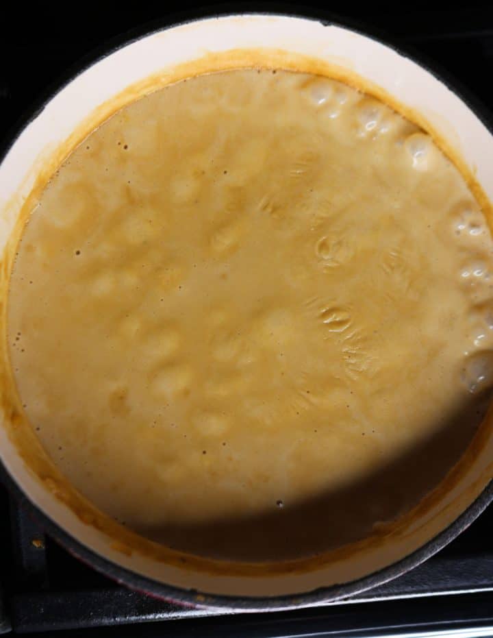 Pot of arroz con leche with milk film