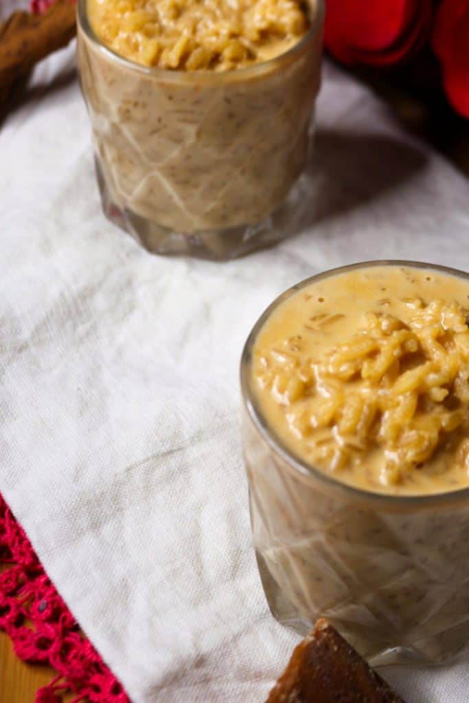 Side view of two glass cups with arroz con leche