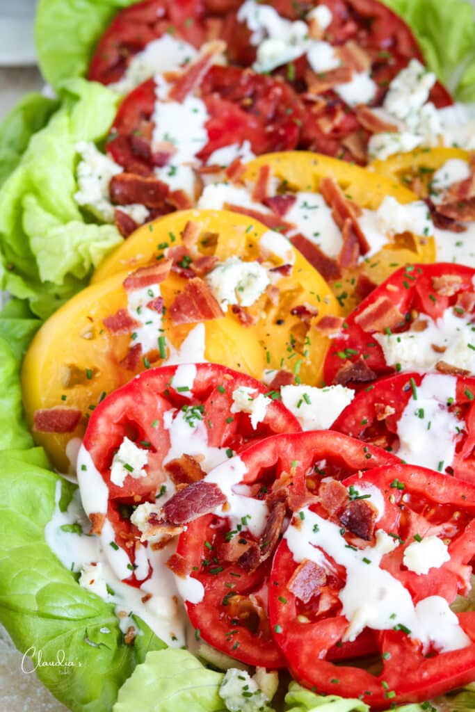 close up of BLT salad with bacon pieces and blue cheese 