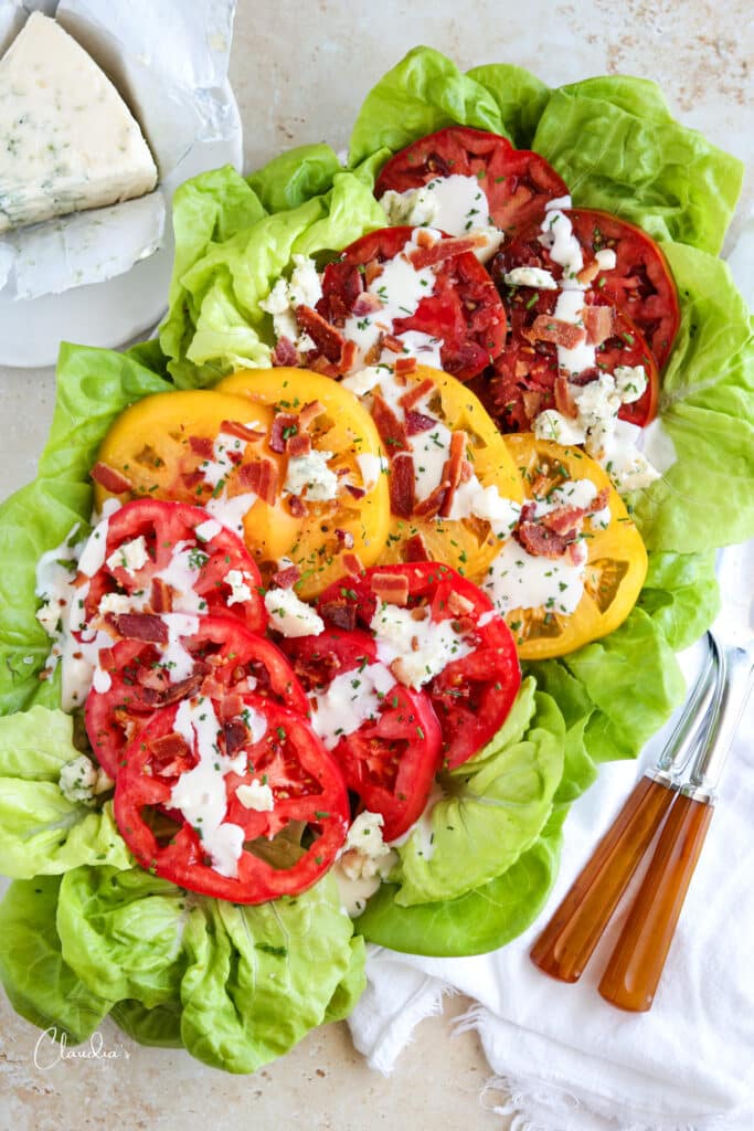 BLT salad with blue cheese dressing, crumbles and bacon bits 