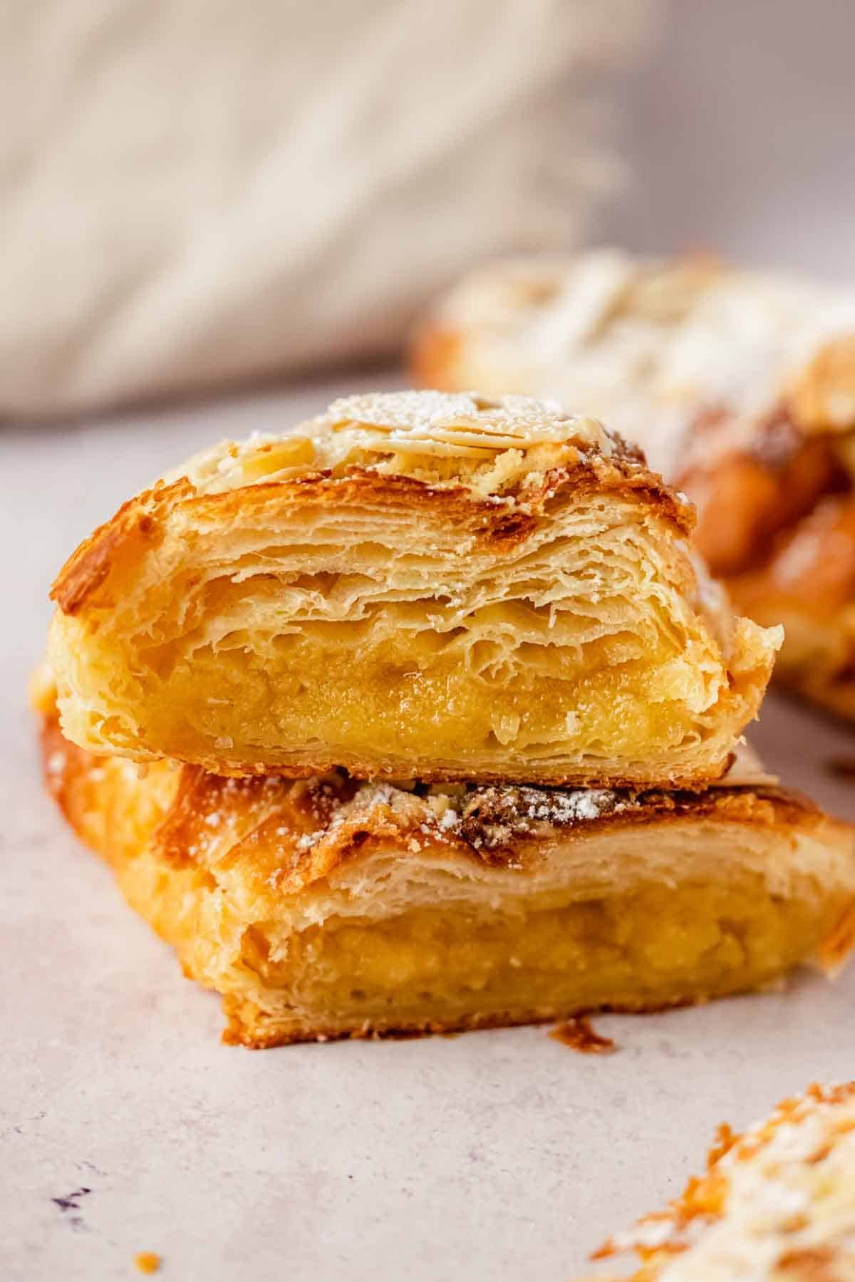 almond croissant cut in half with frangipane filling