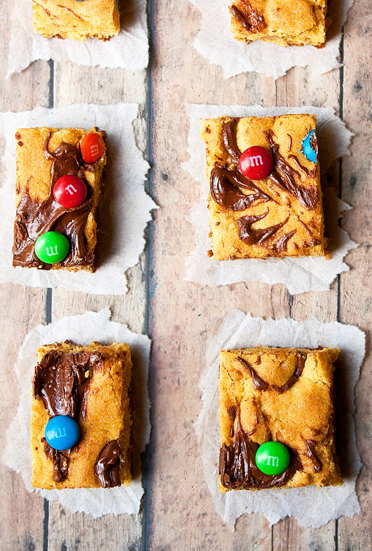 Dessert Slices on Rustic Wood Background.