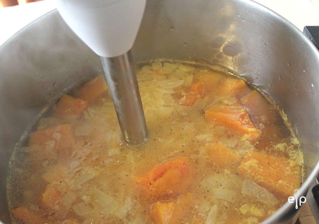 blending butternut squash with immersion blender