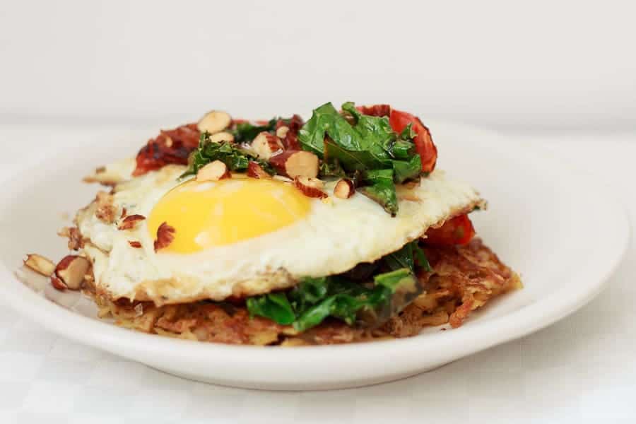 Potato latke topped with egg, kale, tomatoes and Tamari almonds