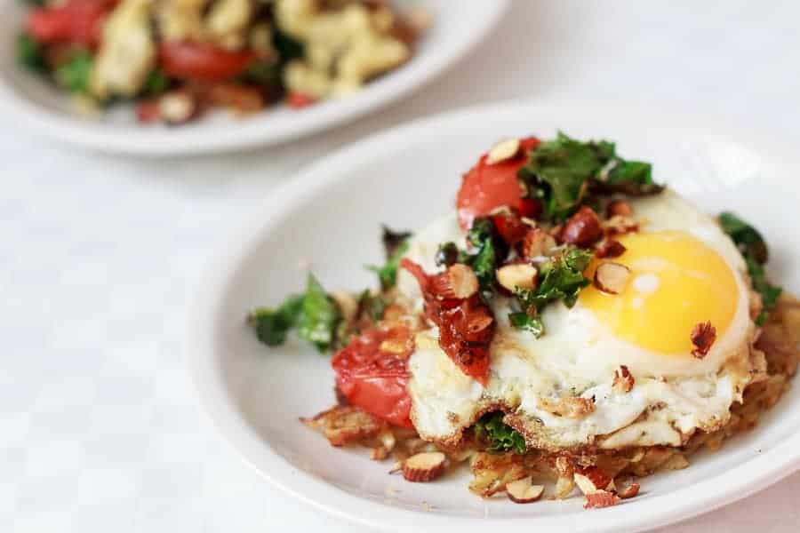 Potato latke topped with egg, kale, tomatoes and Tamari almonds