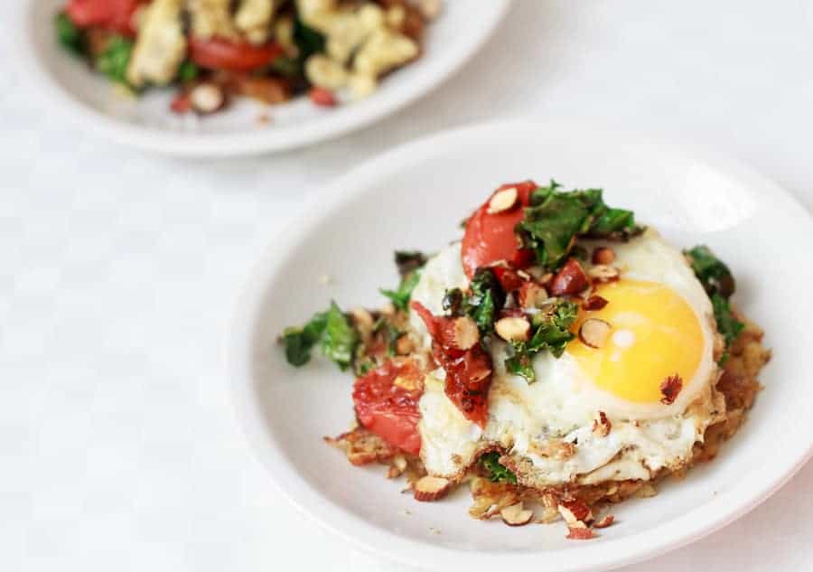 Potato latke topped with egg, kale, tomatoes and Tamari almonds