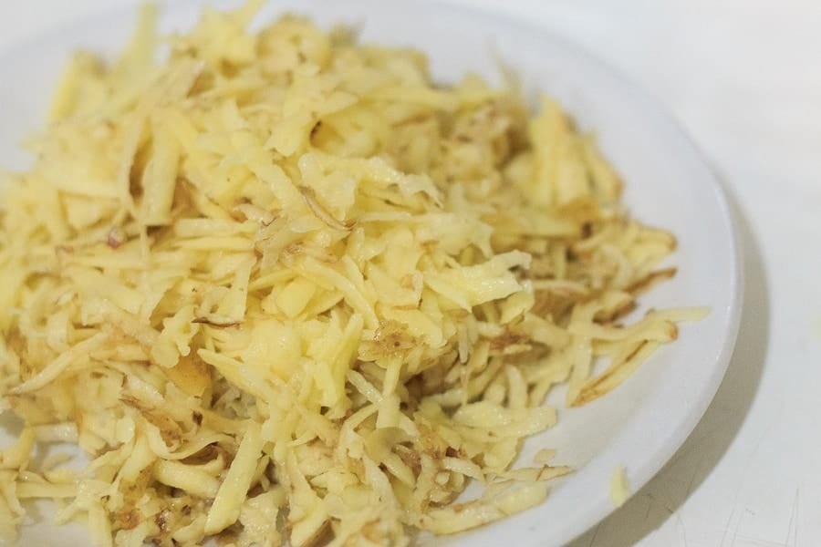 Potato latke topped with egg, kale, tomatoes and Tamari almonds