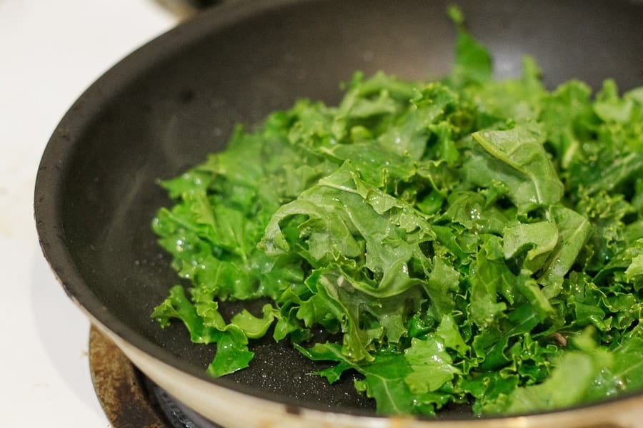 Potato latke topped with egg, kale, tomatoes and Tamari almonds