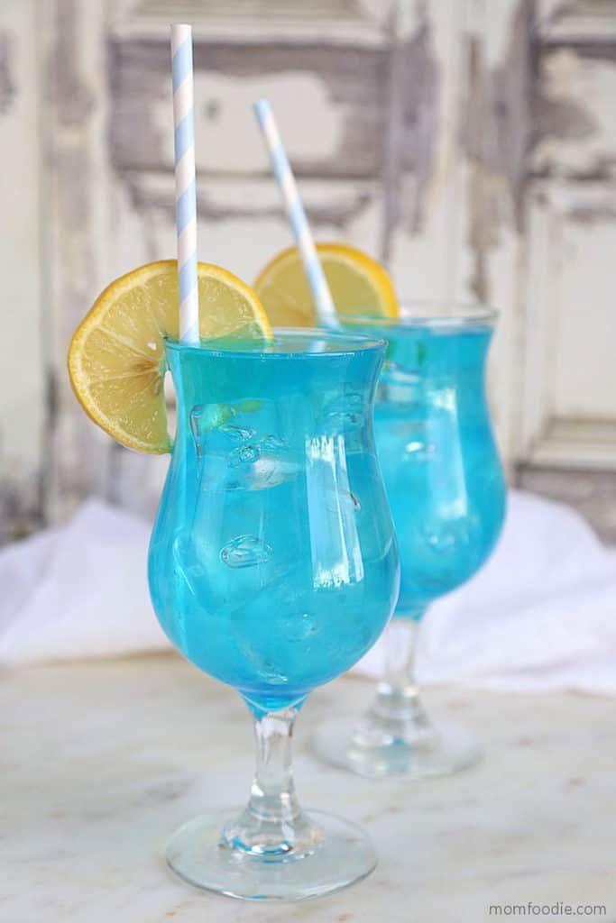 bright blue drinks with lemon slices
