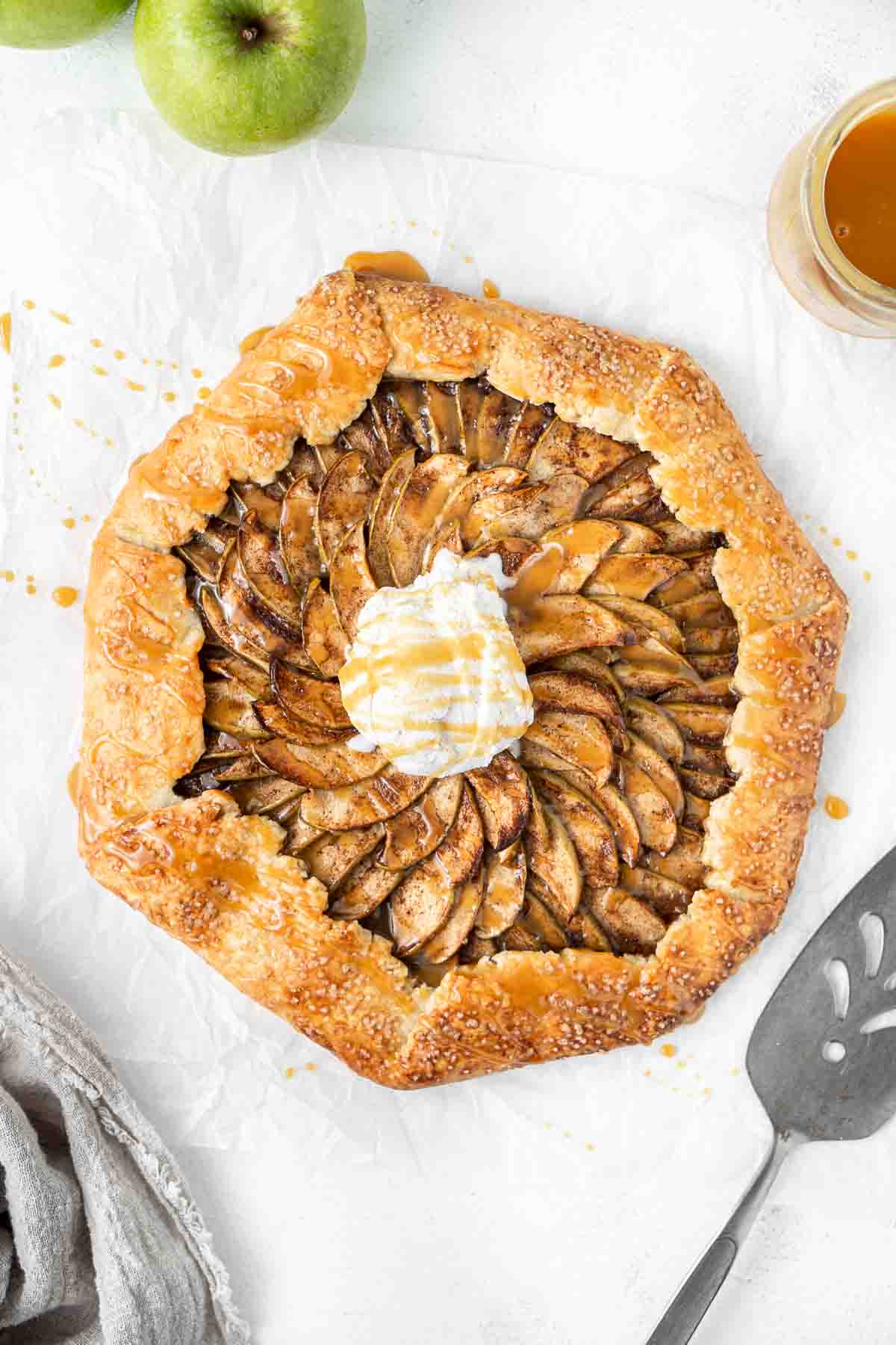 Caramel apple galette with extra caramel sauce and vanilla ice cream.