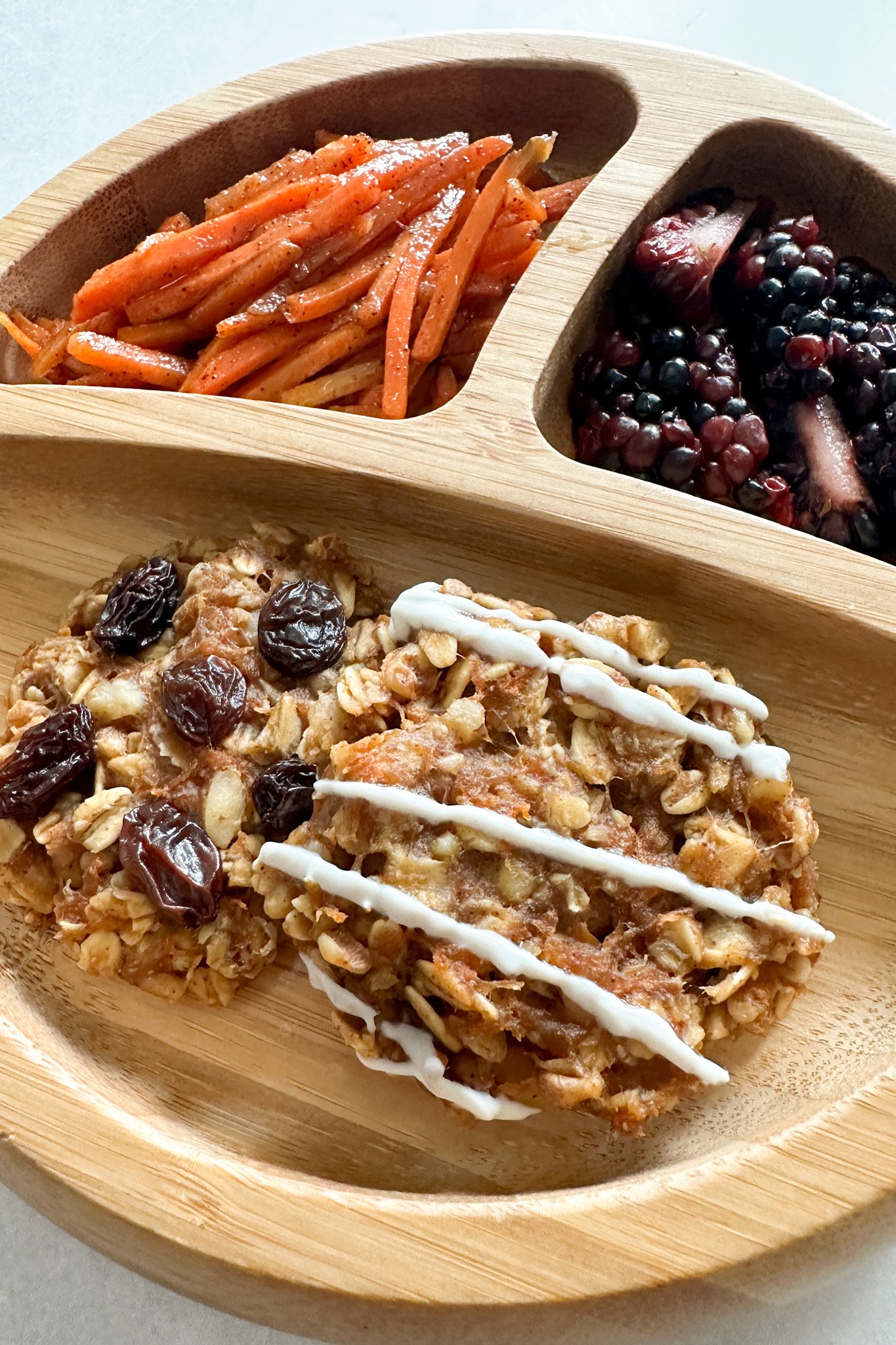 Carrot cake oatmeal cookies served with sauteed cinnamon carrots and blackberries.