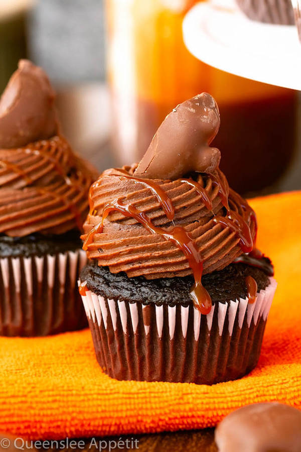 chocolate cupcakes with ganache, chocolate caramel cream cheese frosting, salted caramel and a turtle chocolate on top