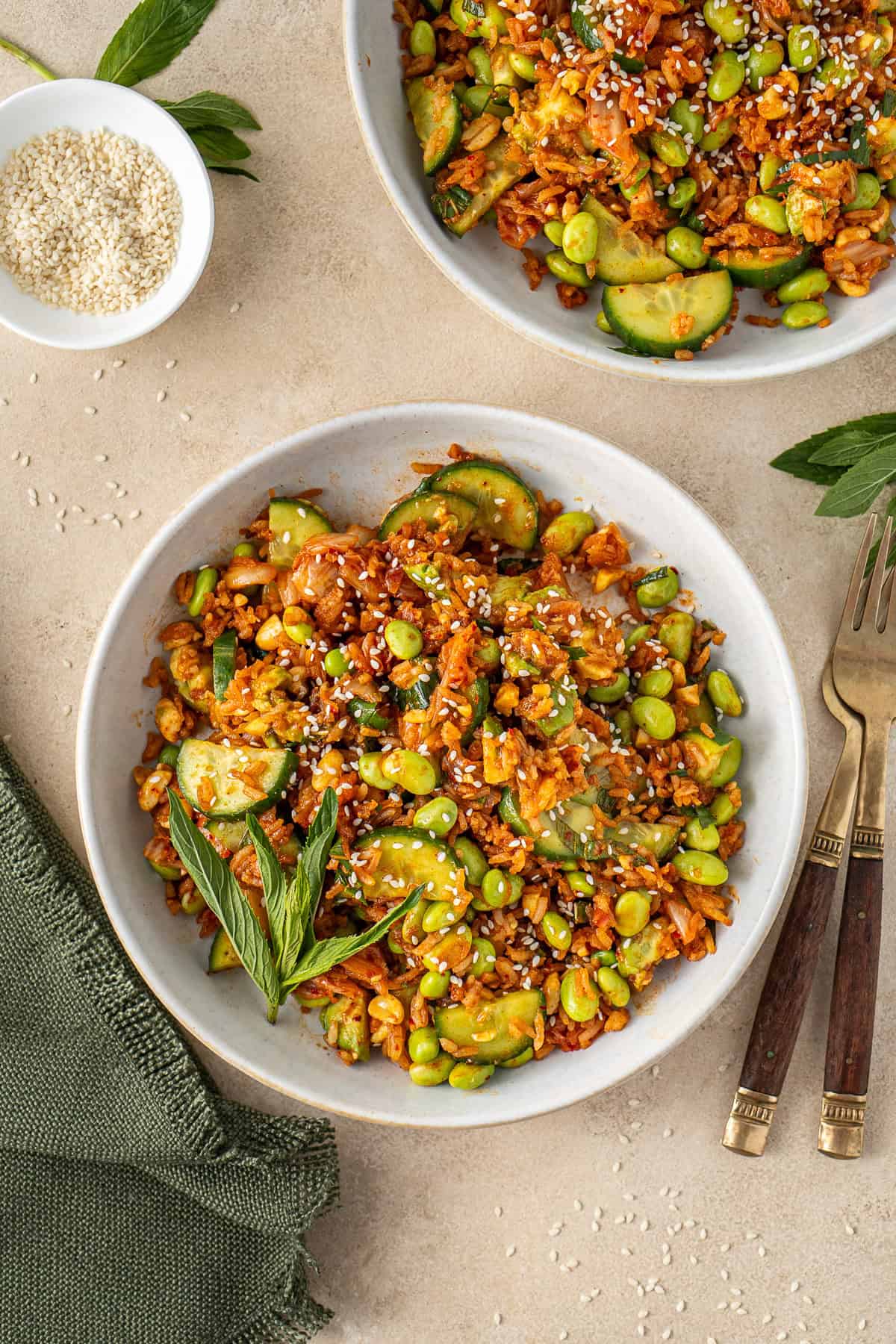 Crispy rice salad served into bowls with fresh mint.