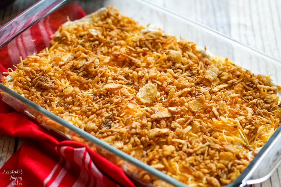 A pan of French Onion Smothered Pork Chops ready to go in the oven. 