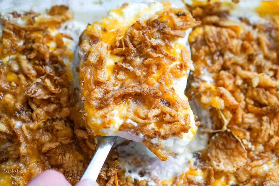 A closeup image of a pork chop being served. 