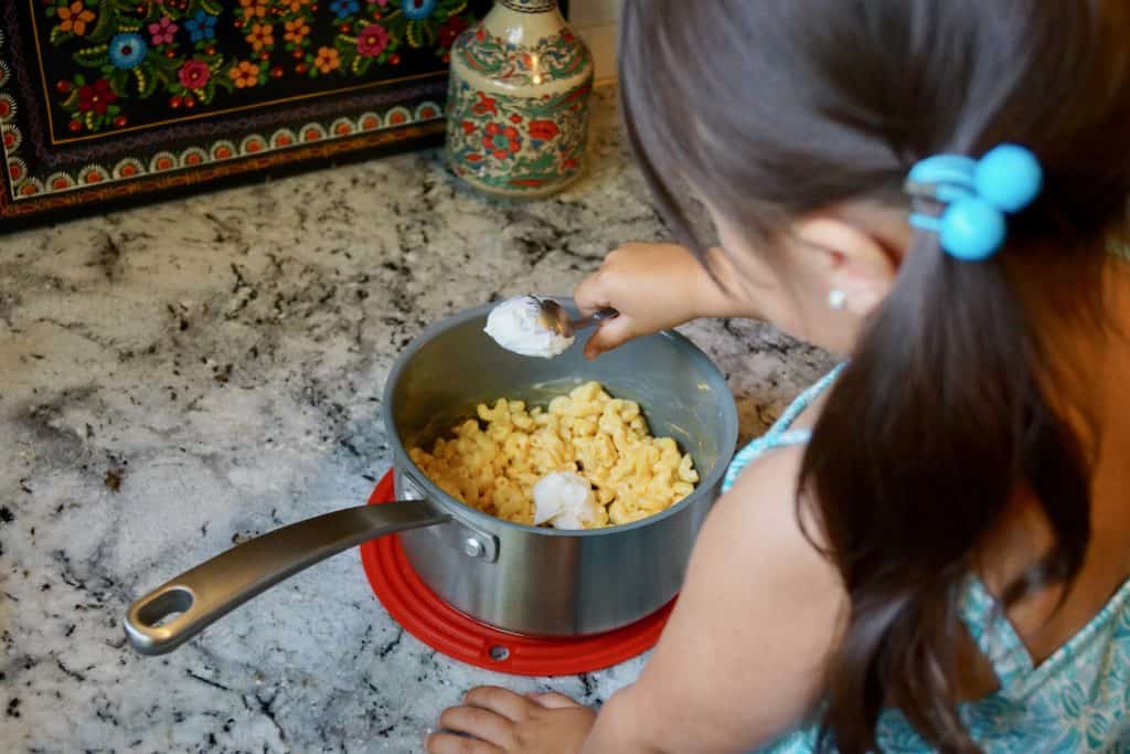 My daughter making boxed mac and cheese