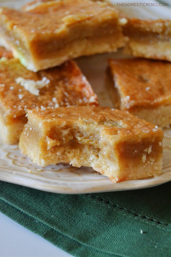 a closeup of a sugar pie square with a bite missing from it