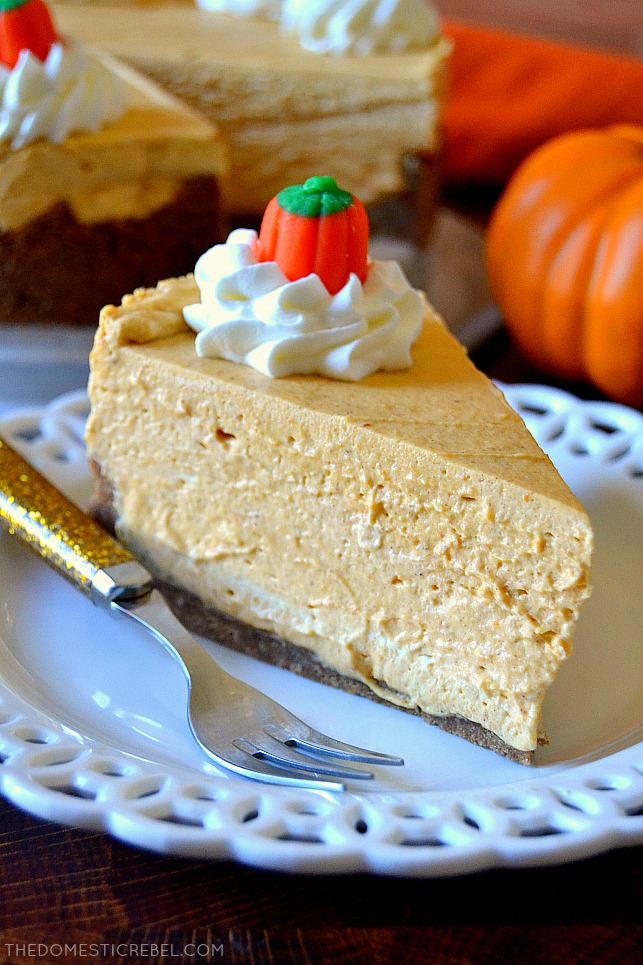 Closeup slice of pumpkin no-bake cheesecake on a white plate with a fork