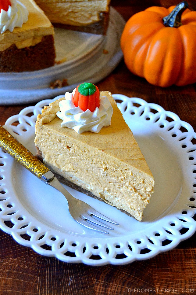 Slice of no-bake pumpkin cheesecake on a white plate with a gold fork