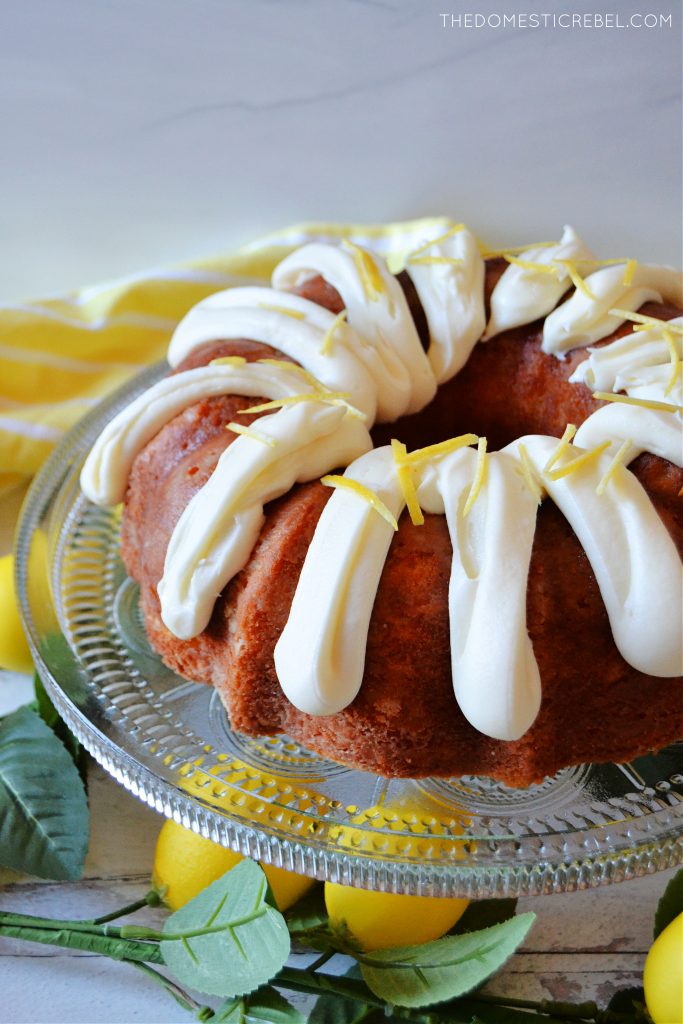 Lemon bundt cake on a glass cake plate