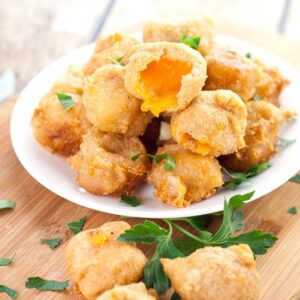 Deep Fried Cheese Bites recipe - Crispy, cheesy Deep Fried Cheese Bites in a flavorful beer batter make a perfect snack, appetizer, or even a side to your favorite burger. A cheese lover's dream! Love this for an easy appetizer recipe.