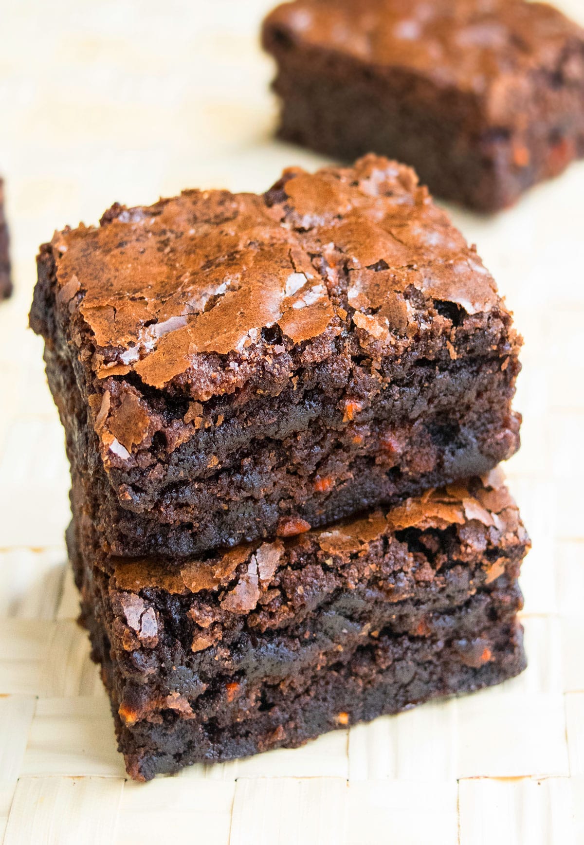 Stack of Easy Carrot Brownies With Box Mix on Wood Background. 