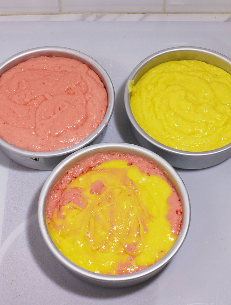 pans of cake mix ready to bake