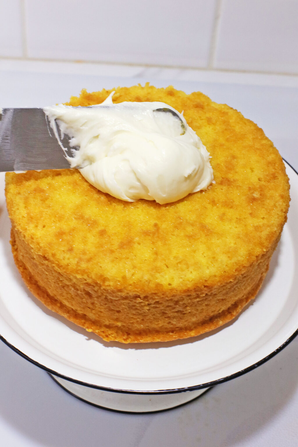 using frosting knife to frost bunny cake