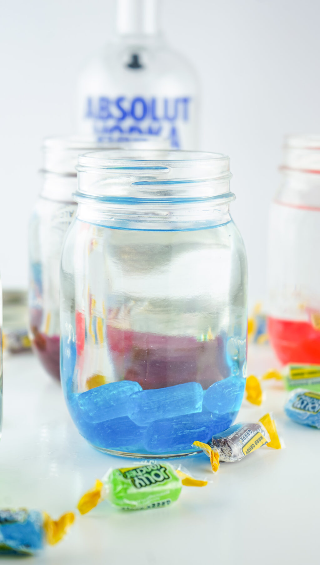 blue jolly rancher vodka in mason jar