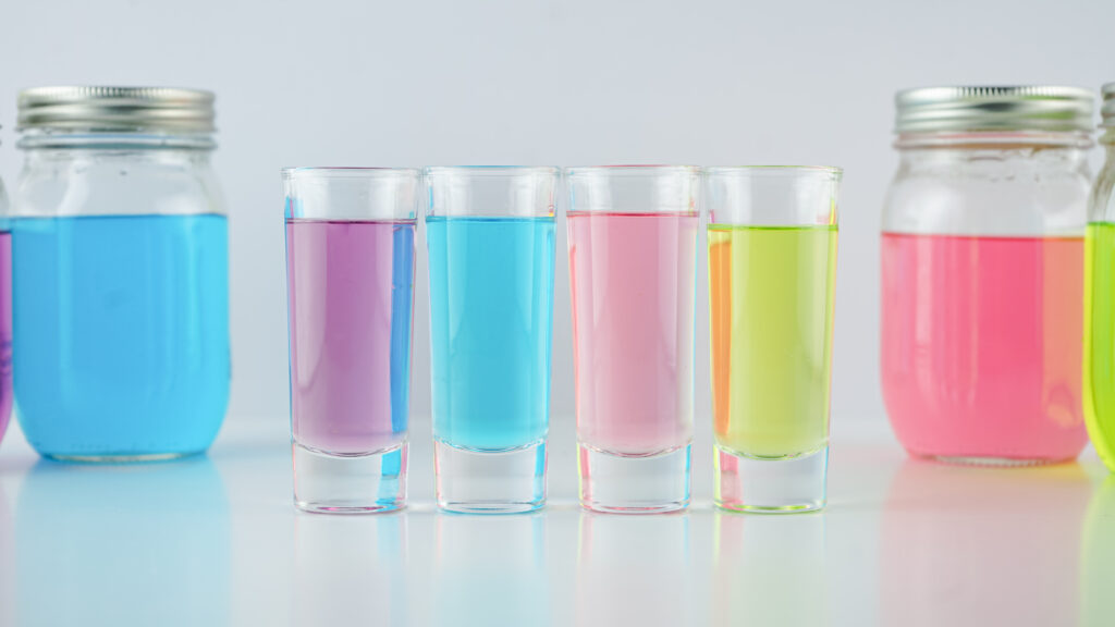 jolly rancher vodka shots and mason jars on white table