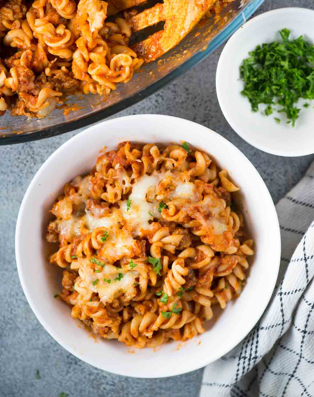 Our favourite Pasta Bake - tangy tomato sauce, spicy Italian Sausage and lots of cheese together makes this baked pasta dish delicious and super satisfying. 