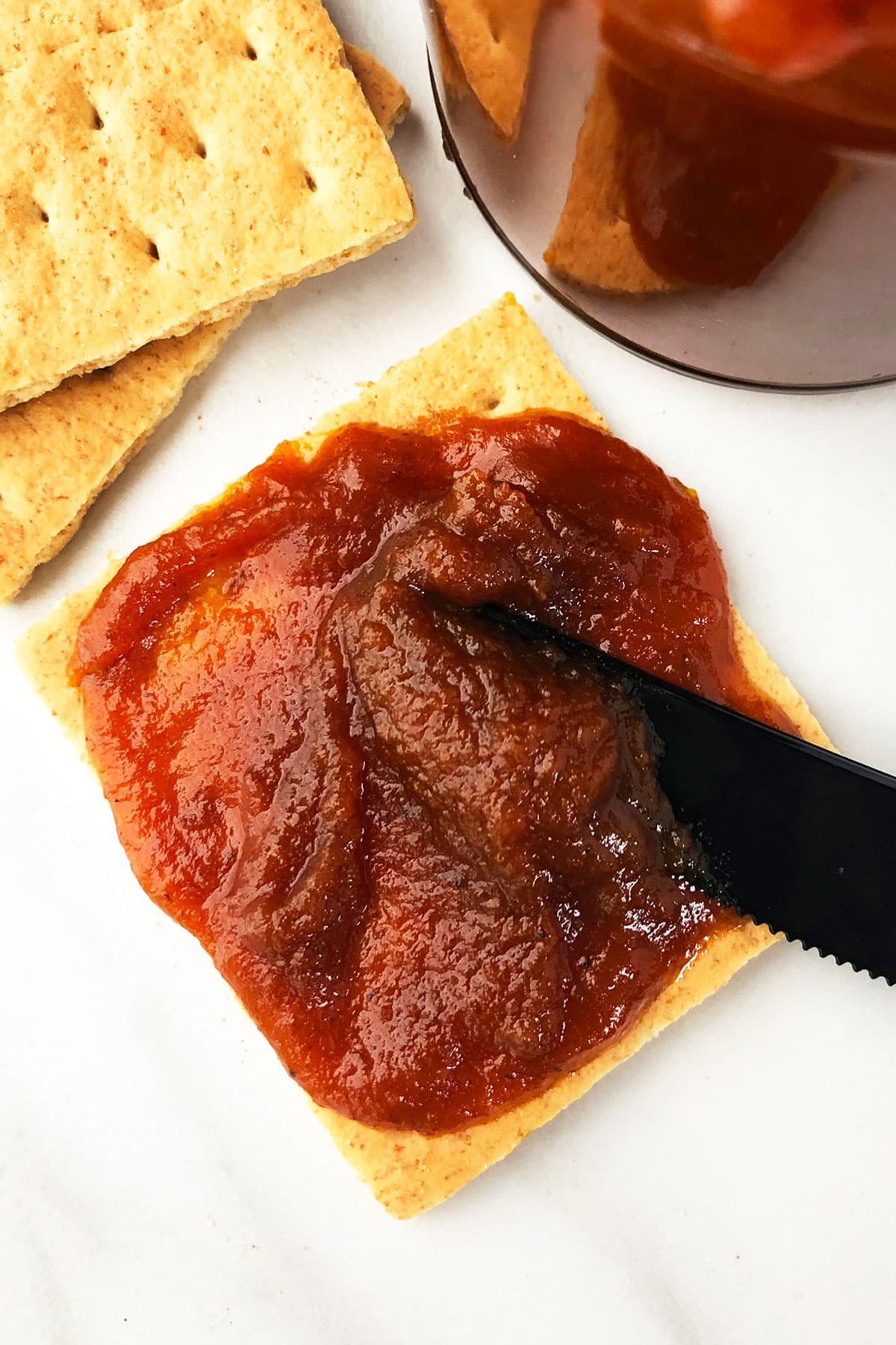 Graham Cracker With Pumpkin Spread on Marble White Background. 