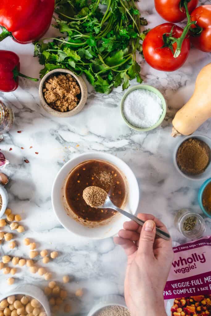 adding cumin to dipping sauce