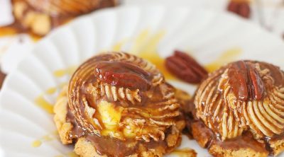 A couple of turtle cookies drizzled with caramel and chocolate sauce