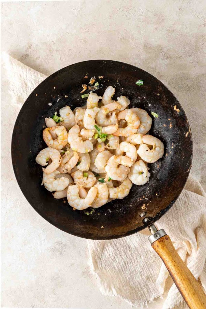 Cooking prawns in a wok.
