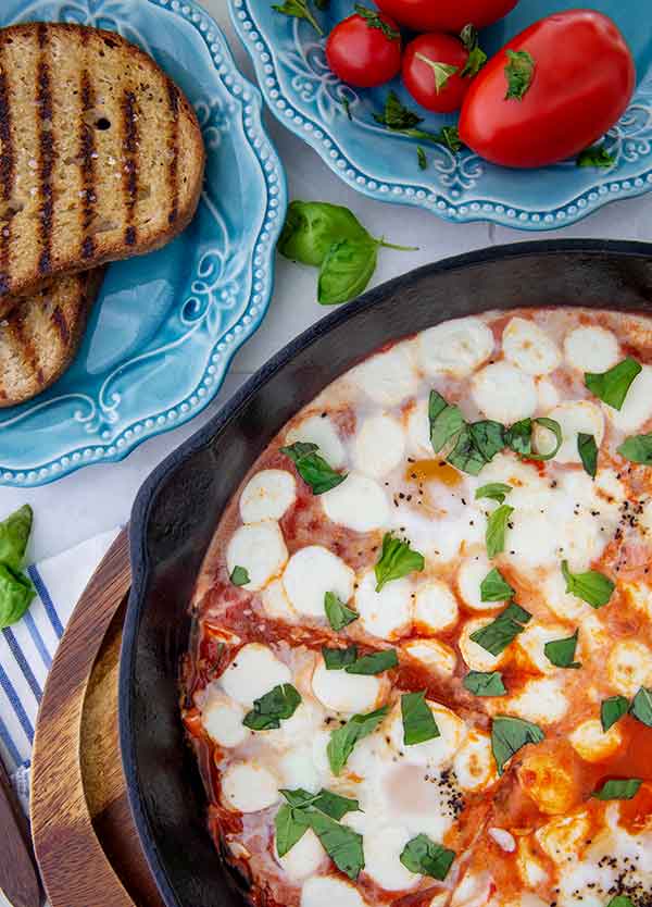 Gluten Free Eggs alla Pizzaiola in a cast iron skillet.