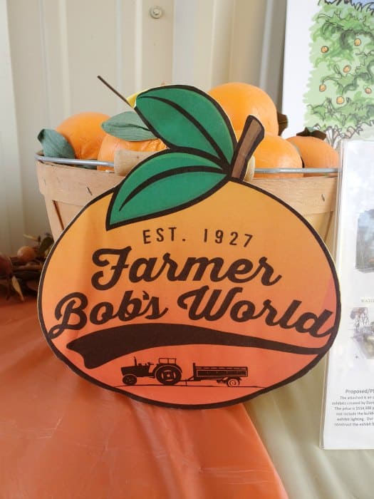 Farmer Bob's World sign with oranges in a basket