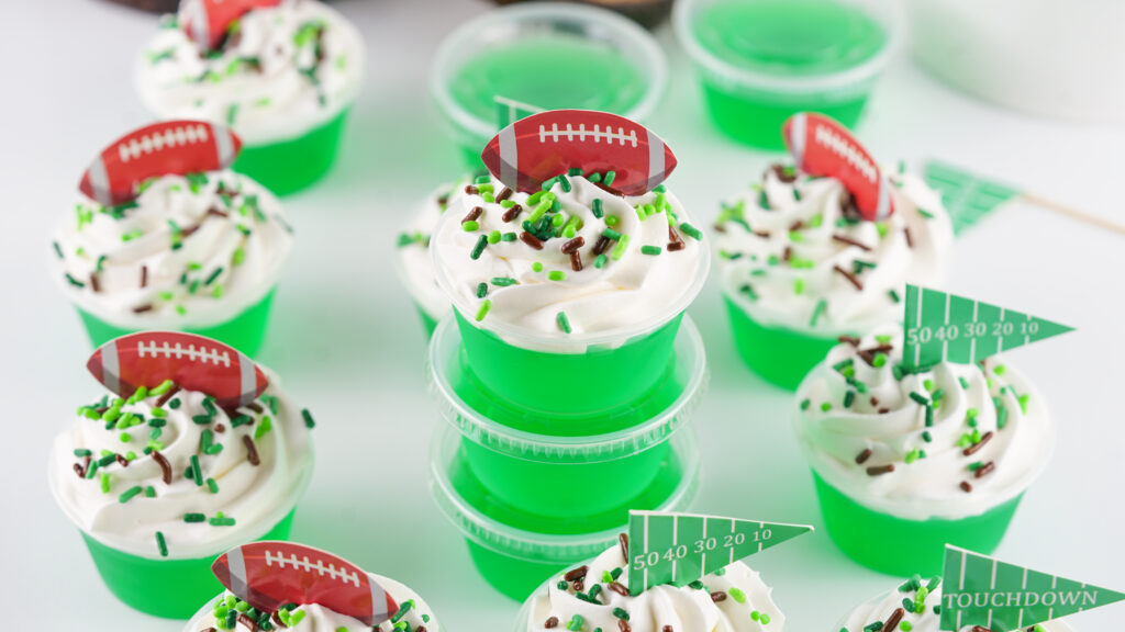 football jello shots on a white table