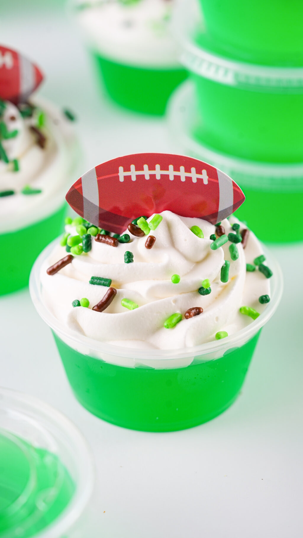 football jello shots on a white table