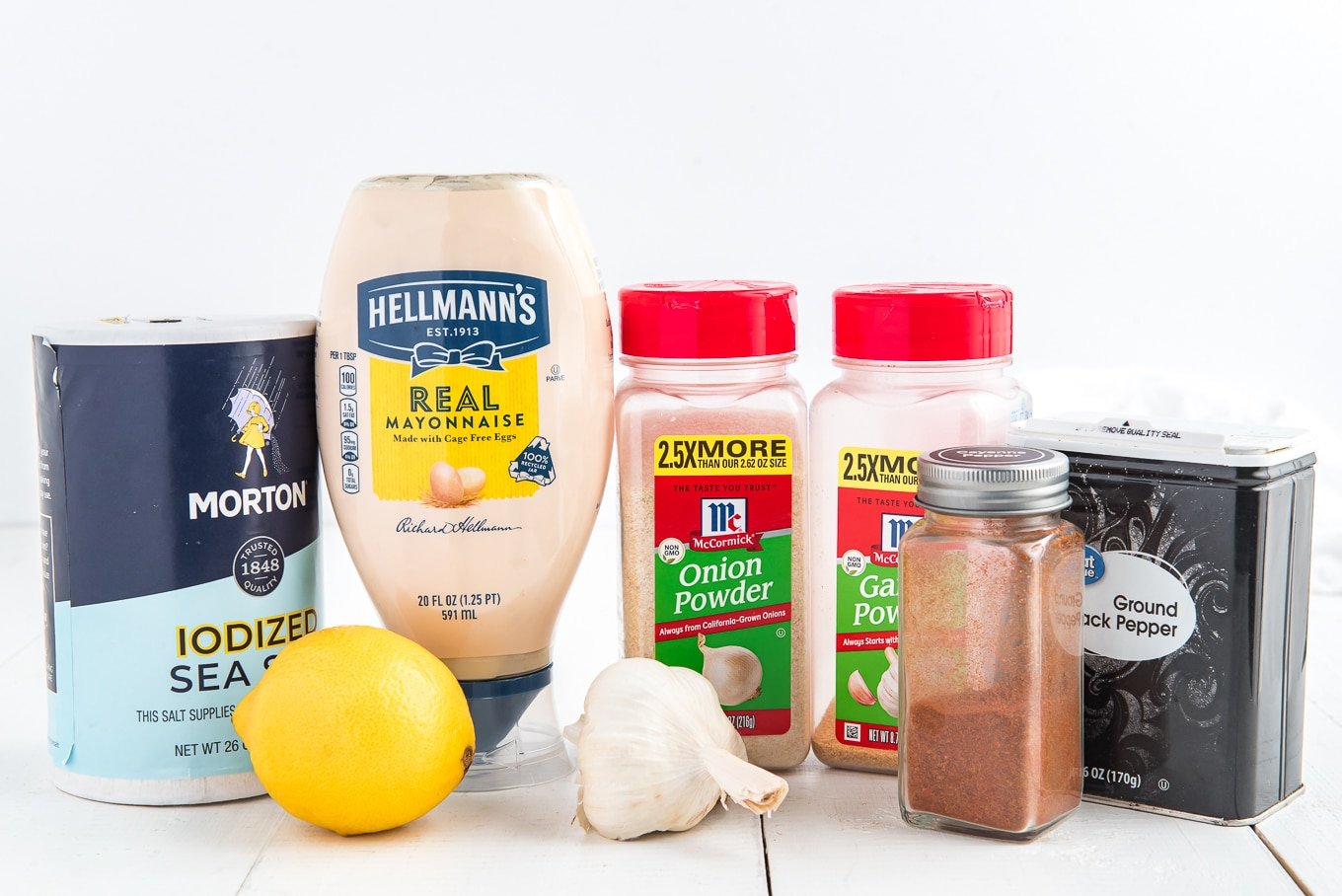 Ingredients to make garlic aioli on the table.